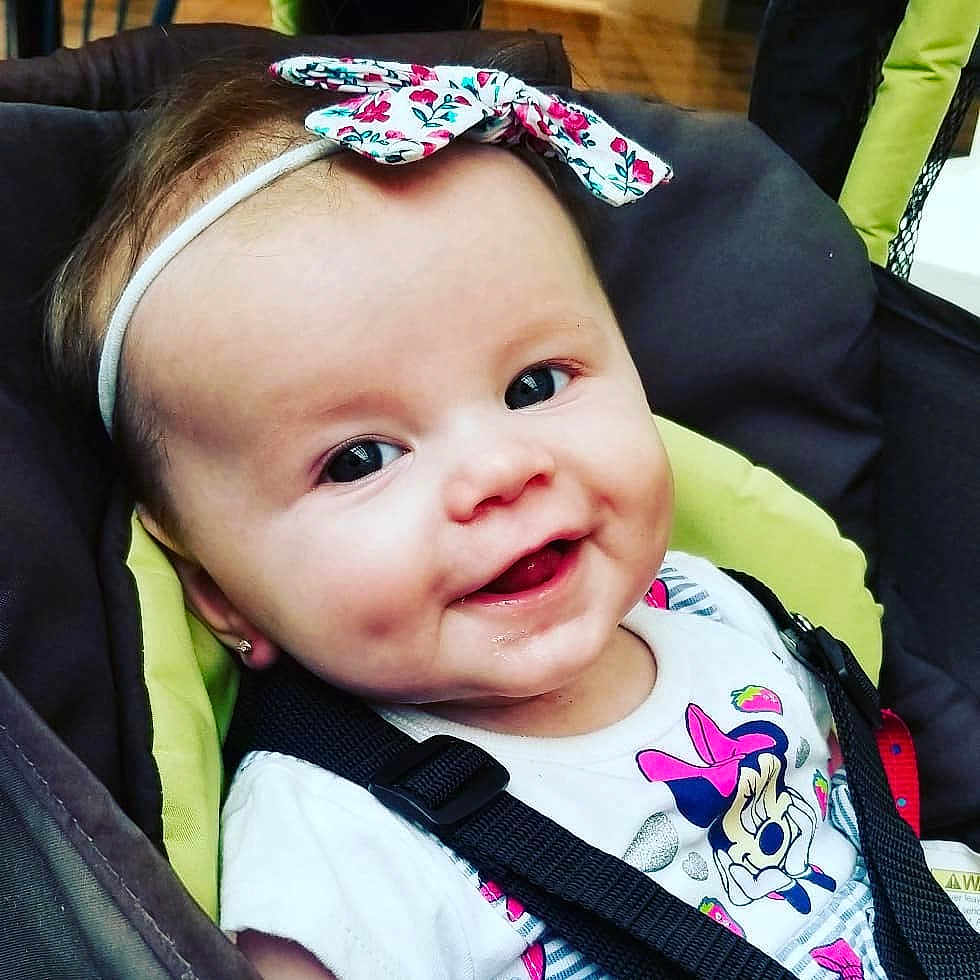 Emily Rose joined the competition — help win amazing prizes! baby, baby_products, beauty, cheek, child, cool, eye, face, forehead, hair_accessory, head, headband, headgear, lip, nose, person, pink, product, skin, smile