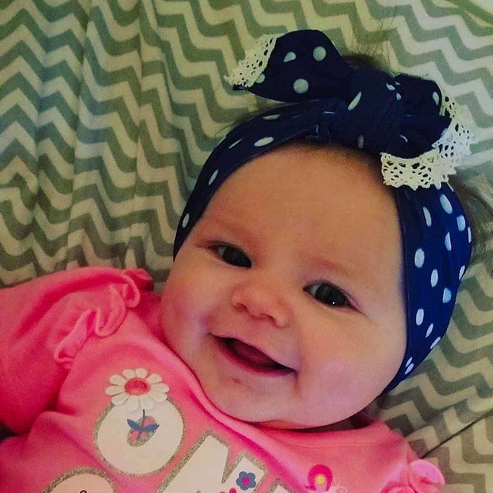 Emily Rose joined the competition — help win amazing prizes! baby, baby_toddler_clothing, cap, cheek, child, cool, design, face, fashion_accessory, hair_accessory, happy, hat, head, headgear, lip, mouth, pattern, person, pink, smile