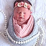 Raylan joined the competition — help win amazing prizes! newborn, baby, sleeping, wrapped, blanket, headband, flowers, beads, soft, pink, gray, white, cute, peaceful, infant, portrait, closeup, cozy, resting, babywear