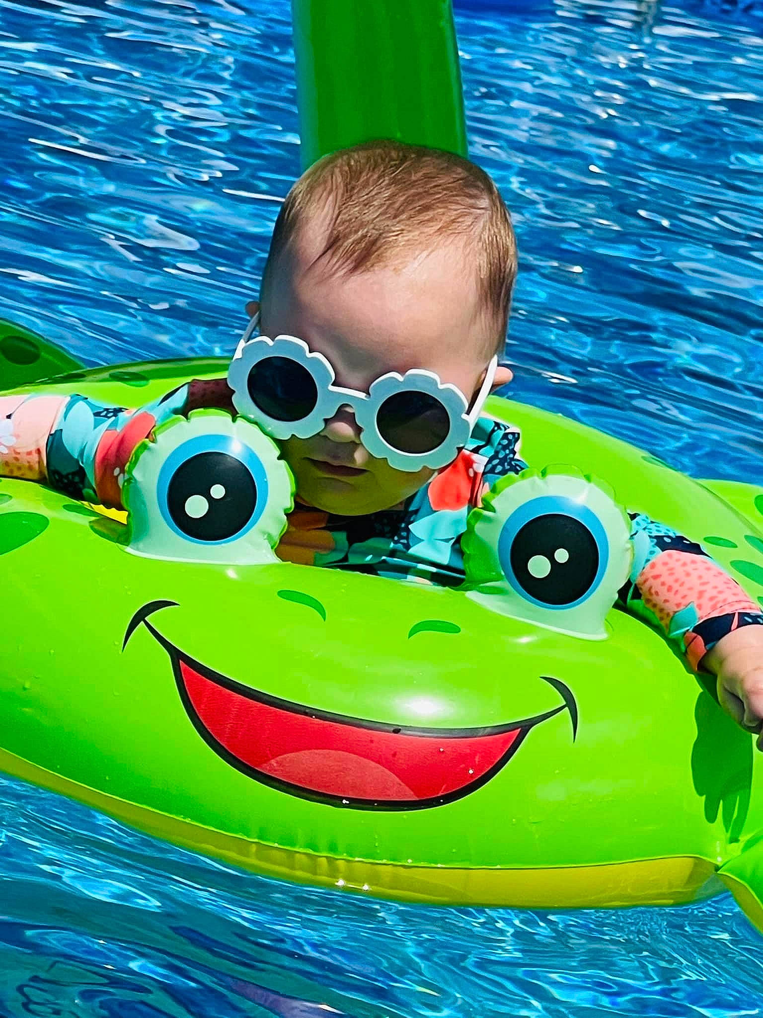 Everleigh is registered to the contest to win money with this photo: aqua, eyewear, face, facial_expression, fun, goggles, green, happy, leisure, outdoor_recreation, person, personal_protective_equipment, product, recreation, red, smile, summer, vision_care, watch, water