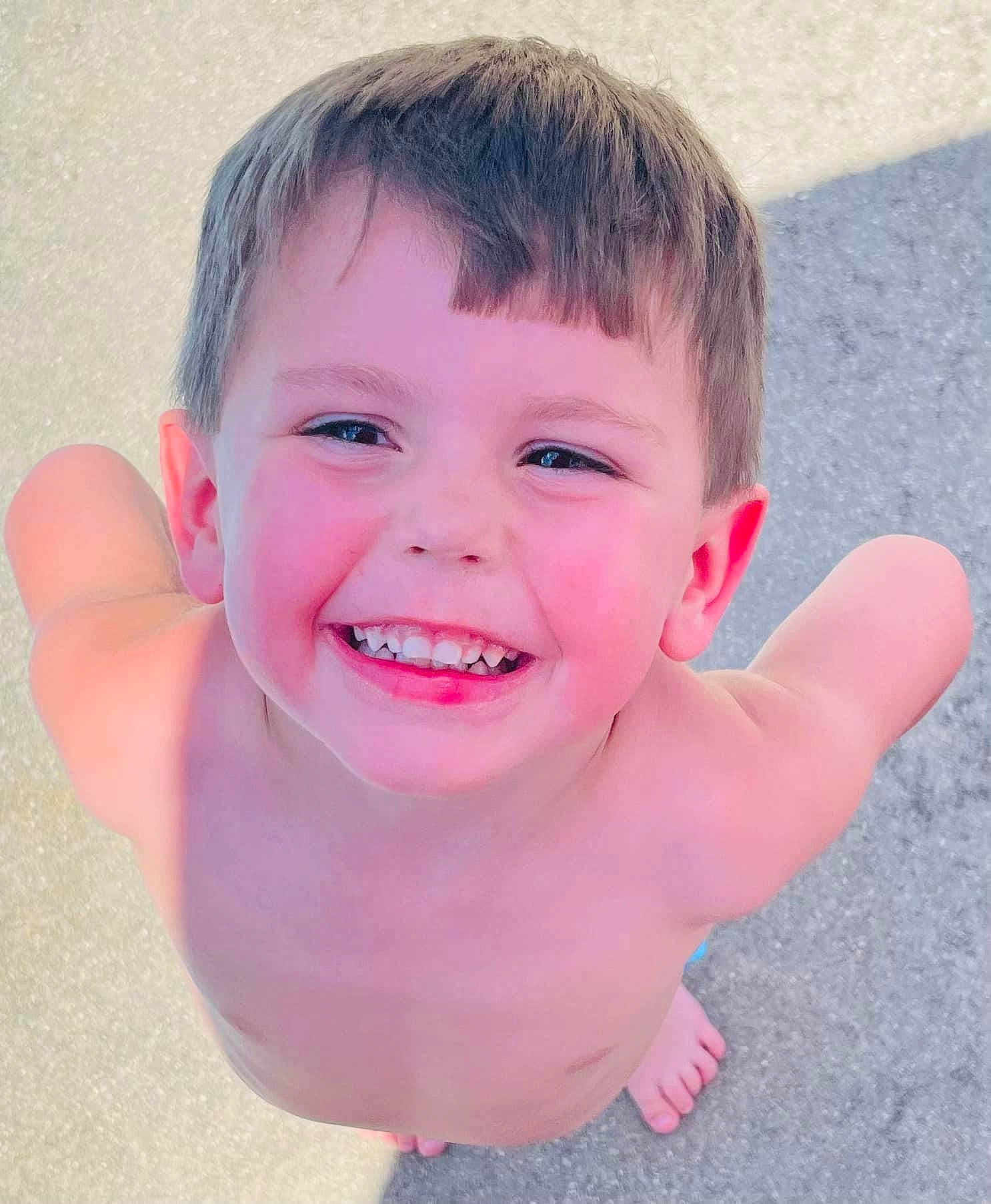 Easton is registered to the contest to win money with this photo: arm, baby_bathing, bathing, cheek, eye, eyebrow, eyelash, face, gesture, hair, happy, head, human_body, iris, jaw, joy, lip, nose, person, pink