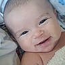Lucas is registered to the contest to win money with this photo: baby, smiling, face, closeup, blanket, infant, skin, head, cheeks, eyes, happy, child, person, soft, cozy, portrait, newborn, cute, lying_down, warm