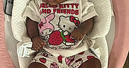Kaylani is registered to the contest to win money with this photo: baby, boots, child, clothing, curly_hair, cushion, cute, earrings, floor, headband, hello_kitty, indoor, infant, pink, pink_bow, portrait, remote_control, seat, shorts, tshirt