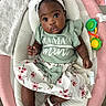 Kaylani joined the competition — help win amazing prizes! baby, blanket, child, clothing, cushion, cute, expression, face, floor, footwear, headband, indoor, infant, looking_up, person, sandal, seat, skirt, small_hands, toy