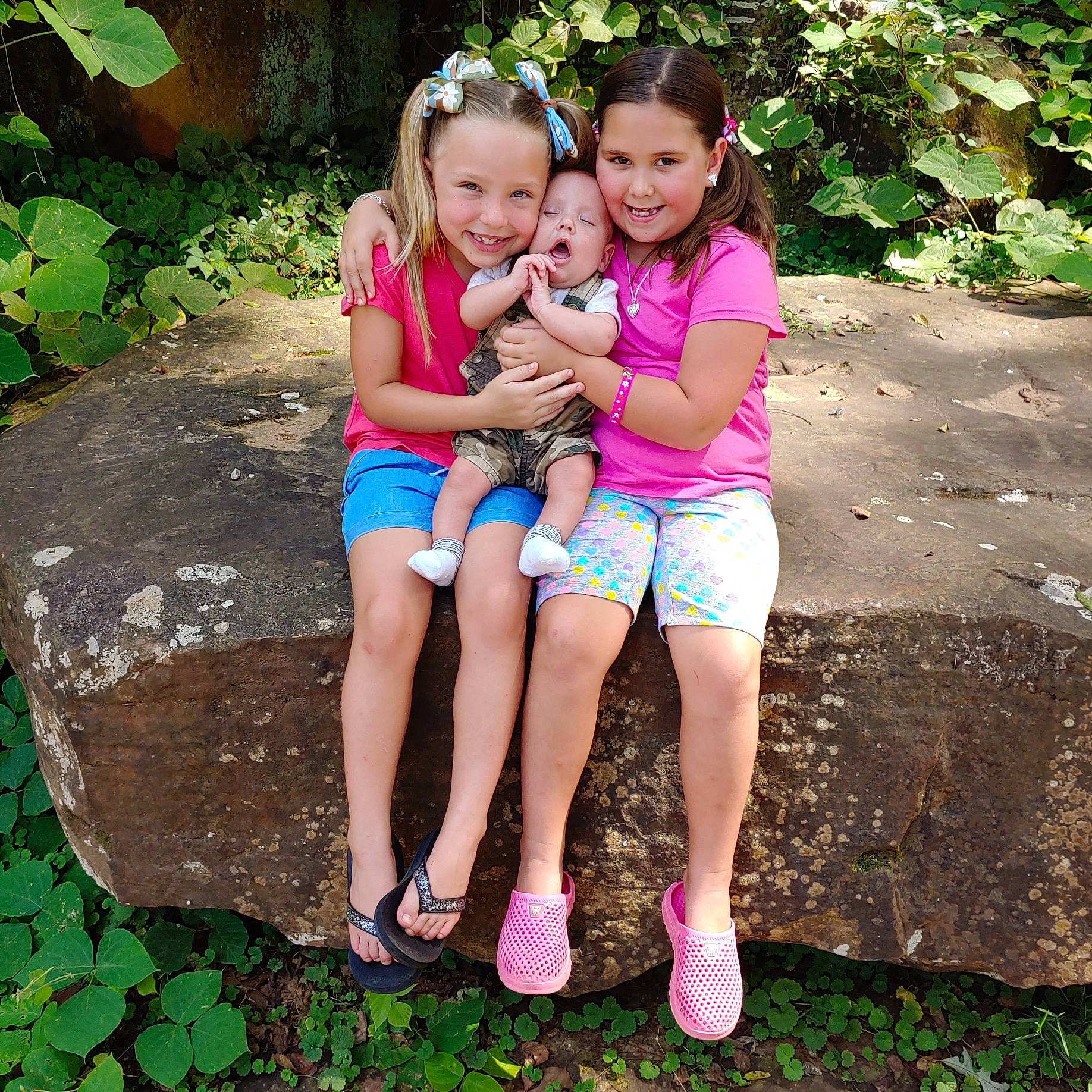 Justin Jr. is registered to the contest to win money with this photo: baby_toddler_clothing, botany, face, fun, grass, green, happy, human_body, joy, leaf, leg, leisure, people_in_nature, person, pink, plant, shorts, smile, summer, thigh