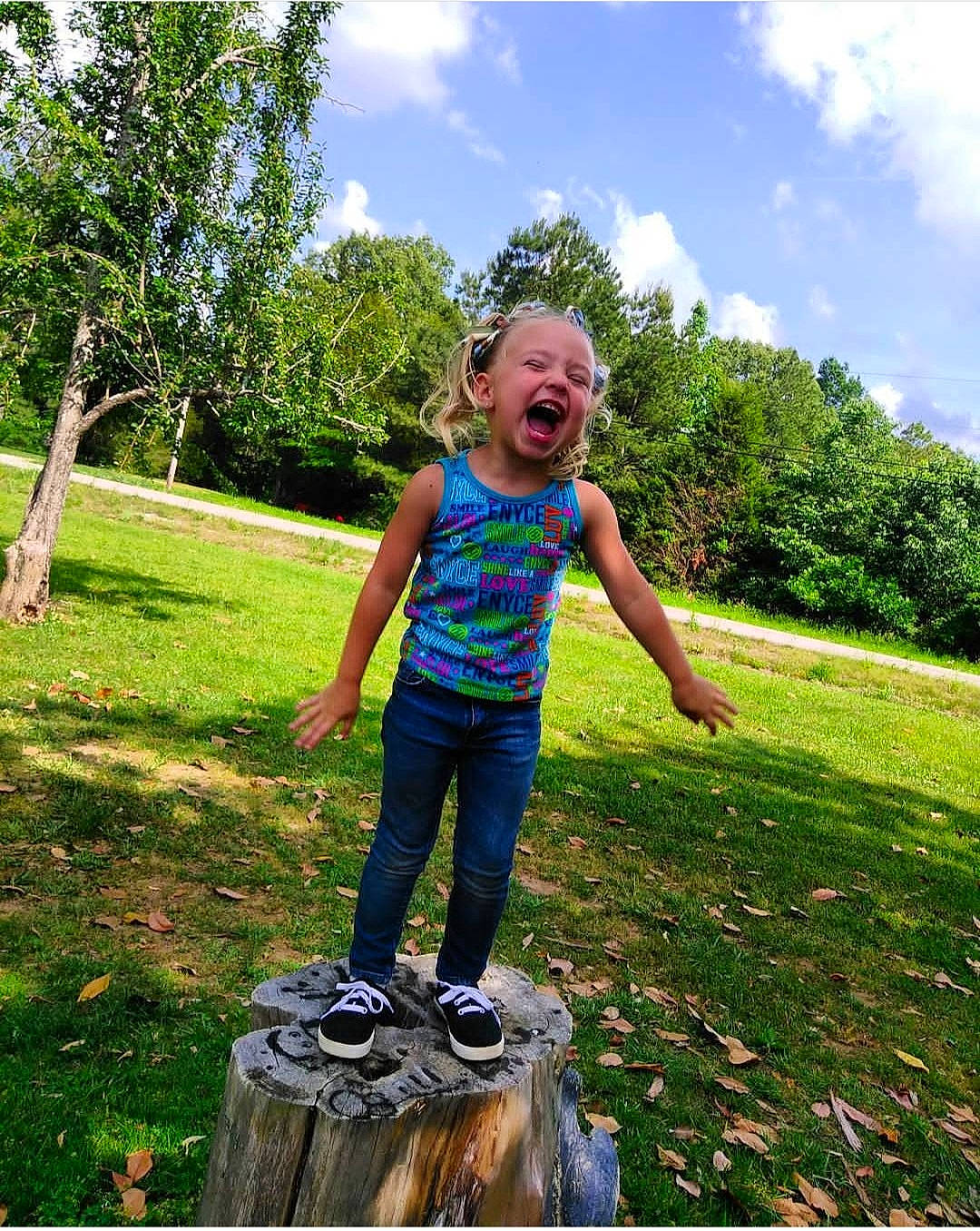 Brailie Kay is registered to the contest to win money with this photo: cloud, footwear, fun, grass, grass_family, grassland, happy, jeans, landscape, lawn, leisure, meadow, people_in_nature, person, plant, sky, smile, summer, t_shirt, toddler