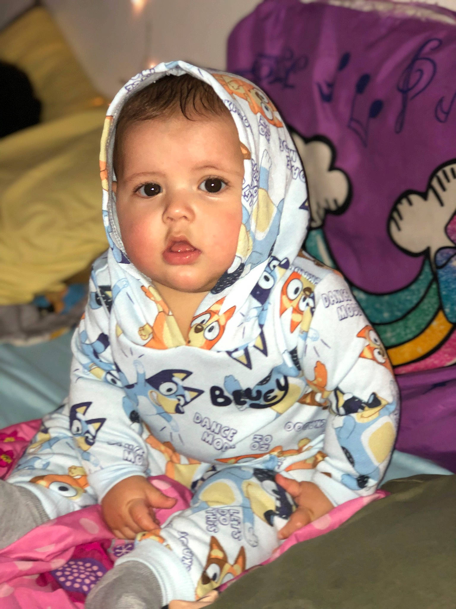 Alonzo is registered to the contest to win money with this photo: baby, baby_toddler_clothing, cheek, child, chin, comfort, event, eye, flooring, fun, happy, head, iris, mouth, nose, person, plant, sitting, skin, sleeve