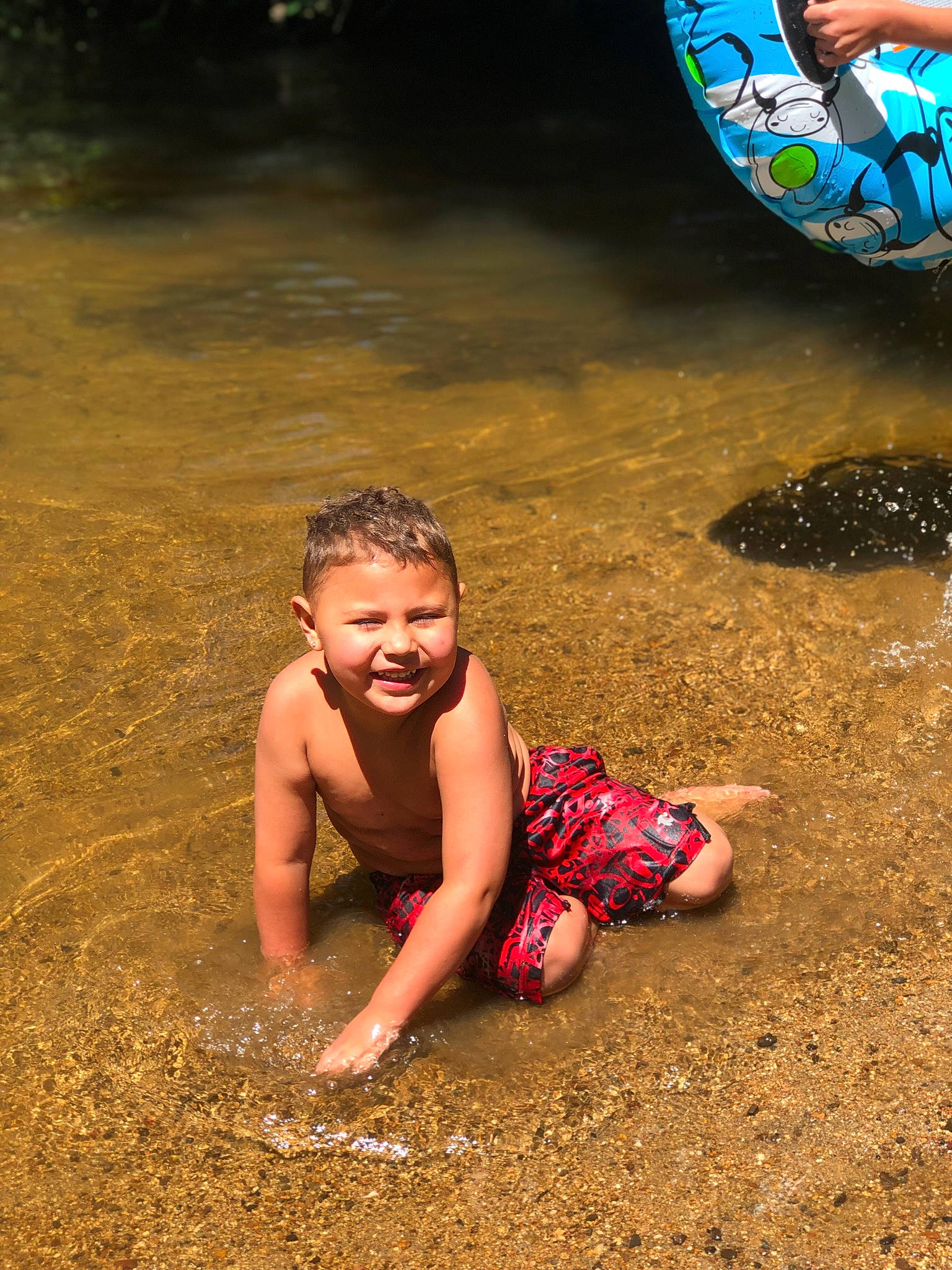 Anthony joined the competition — help win amazing prizes! barefoot, body_of_water, child, flash_photography, foot, fun, grass, happy, human_leg, joy, leisure, people_in_nature, people_on_beach, person, play, recreation, sand, sitting, smile, soil