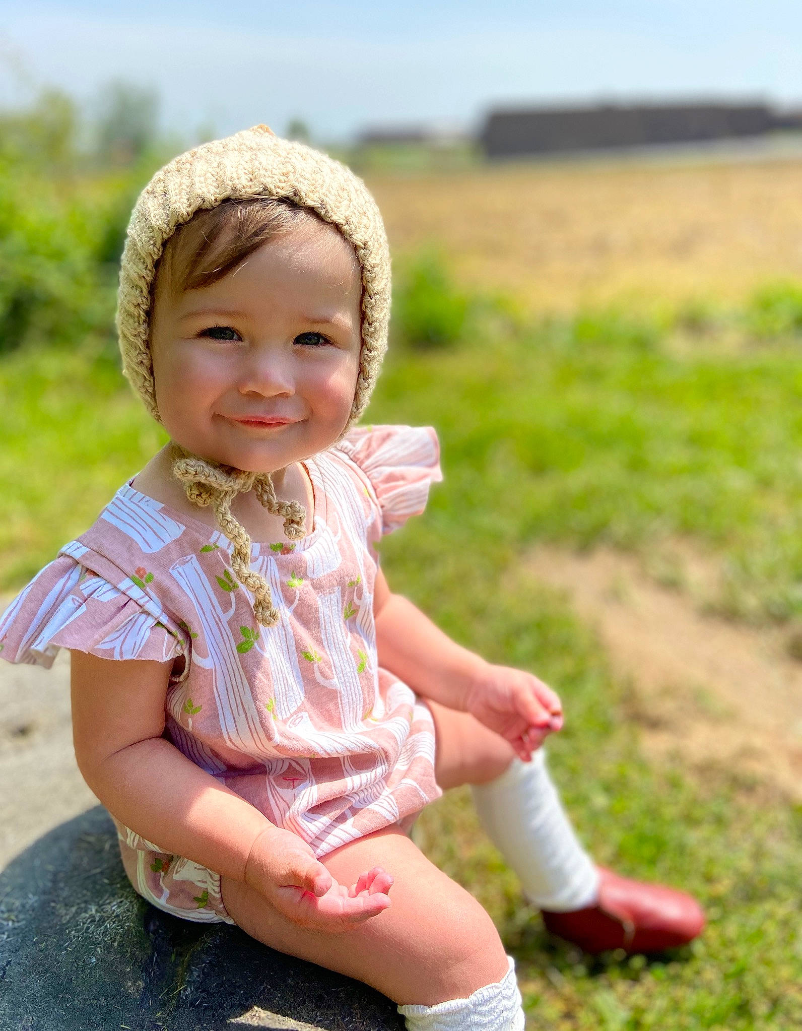 Lakelyn is registered to the contest to win money with this photo: baby, child, child_model, grass, grass_family, grassland, happy, head, headgear, headwear, joy, meadow, people_in_nature, person, photography, pink, plant, sitting, skin, smile