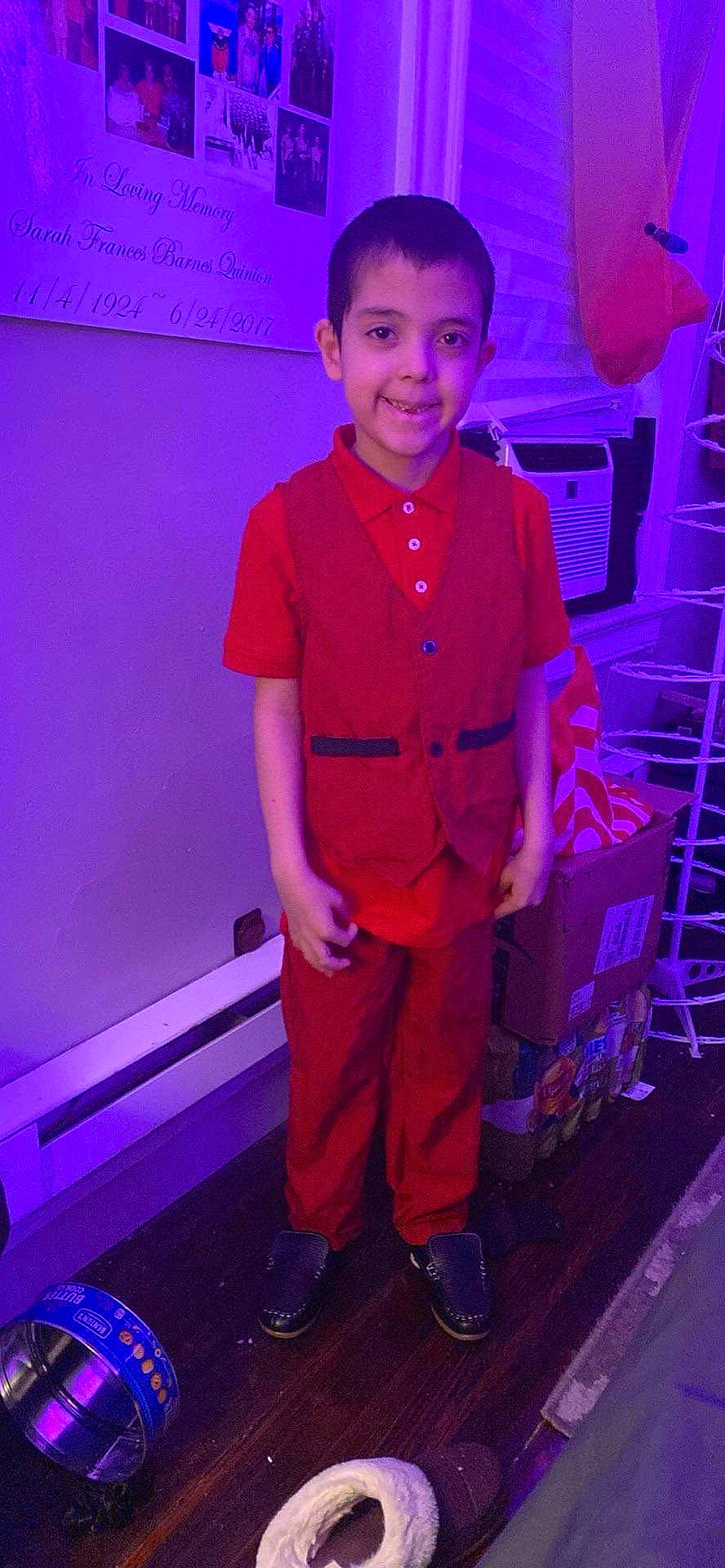 Ezekiel is registered to the contest to win money with this photo: audio_equipment, child, electric_blue, entertainment, event, fashion_design, flooring, fun, happy, joy, magenta, performance, person, pink, purple, red, room, smile, standing, t_shirt