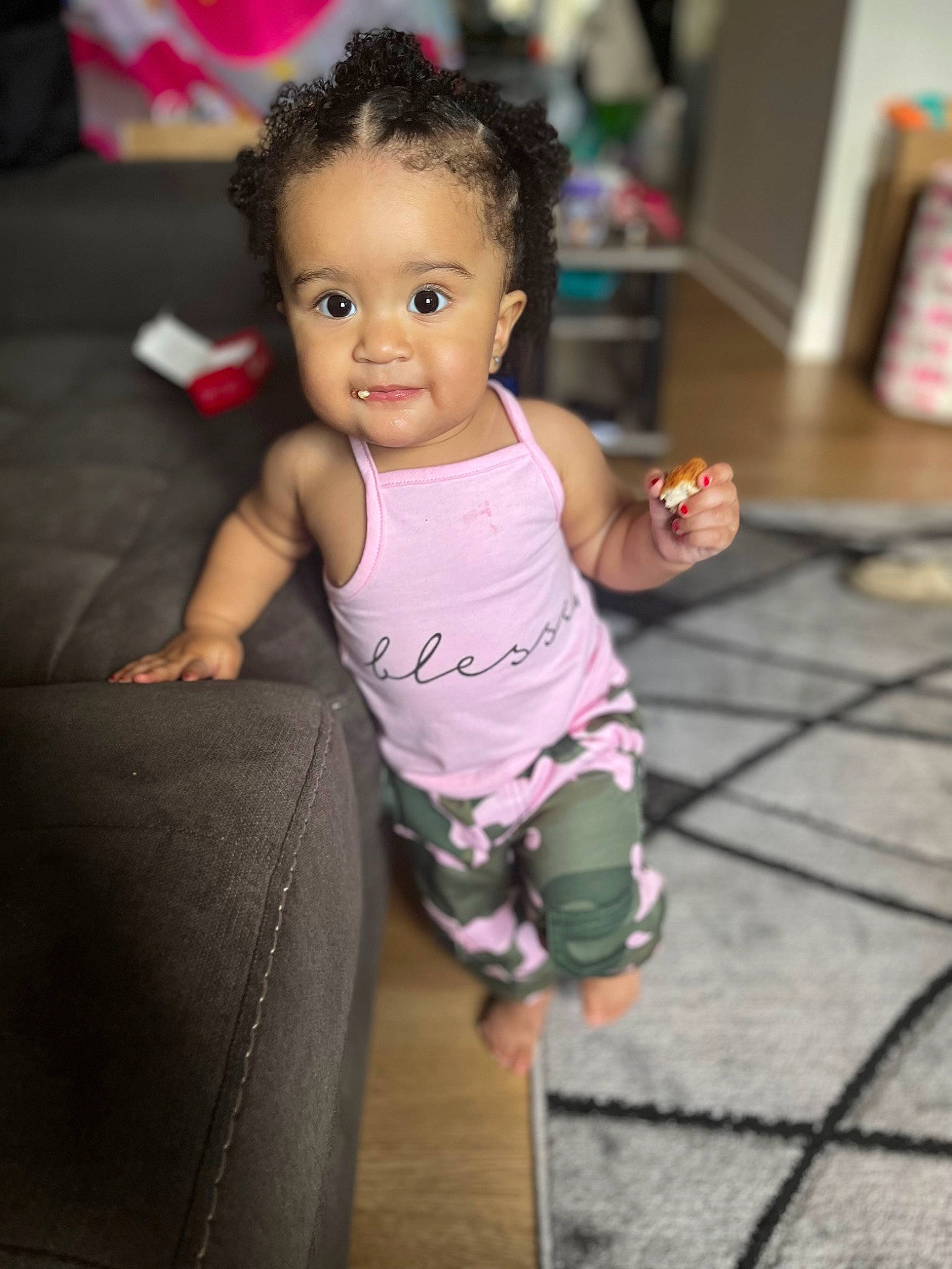 Novaleigh is registered to the contest to win money with this photo: baby, baby_toddler_clothing, cheek, child, eye, face, floor, flooring, fun, gesture, happy, head, human_leg, person, pink, purple, skin, smile, t_shirt, toddler