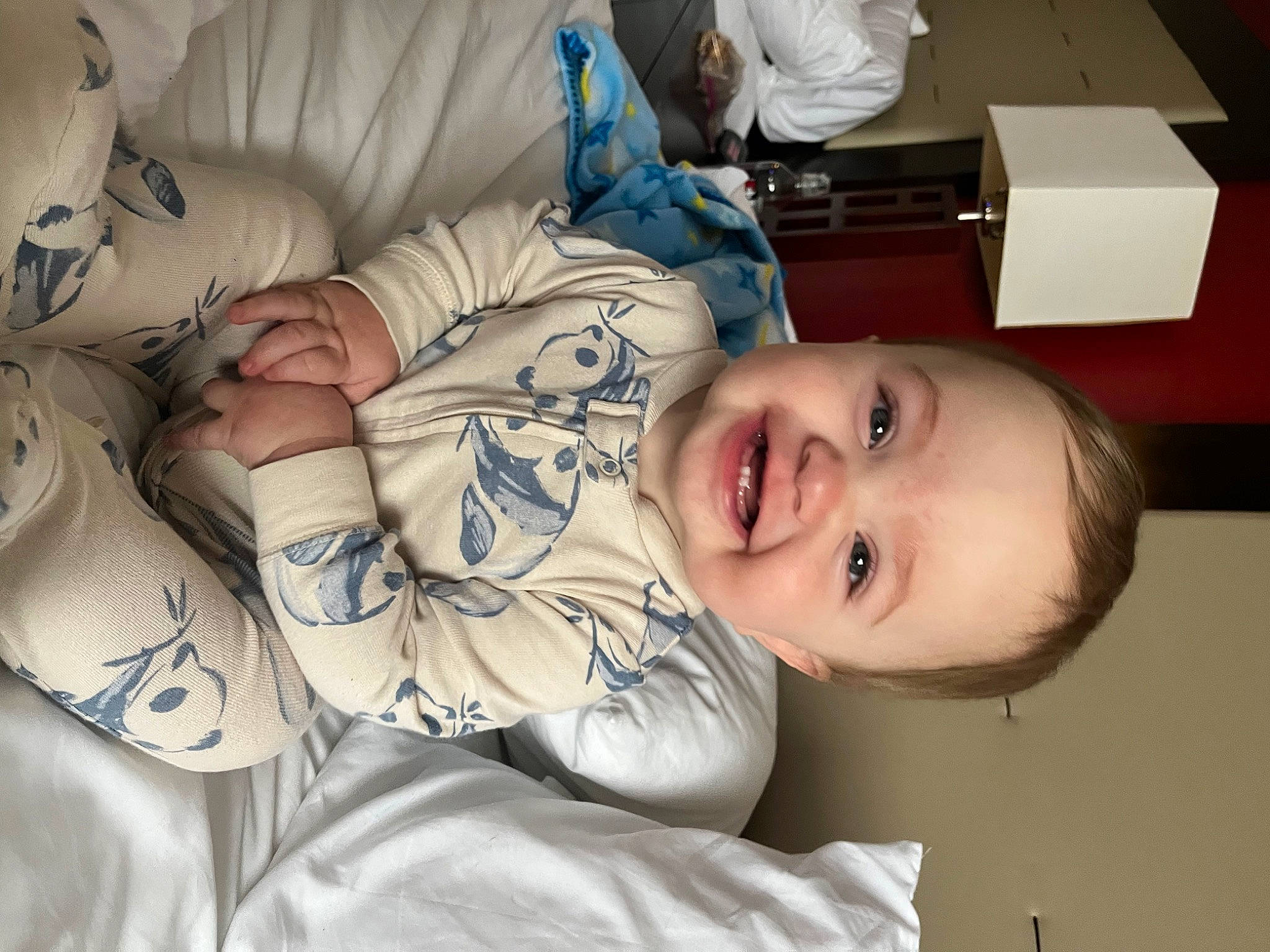 Jasper is registered to the contest to win money with this photo: baby, baby_toddler_clothing, beauty, cheek, child, chin, comfort, elbow, eye, facial_expression, hairstyle, happy, joy, linens, mouth, nose, person, room, skin, sleeve