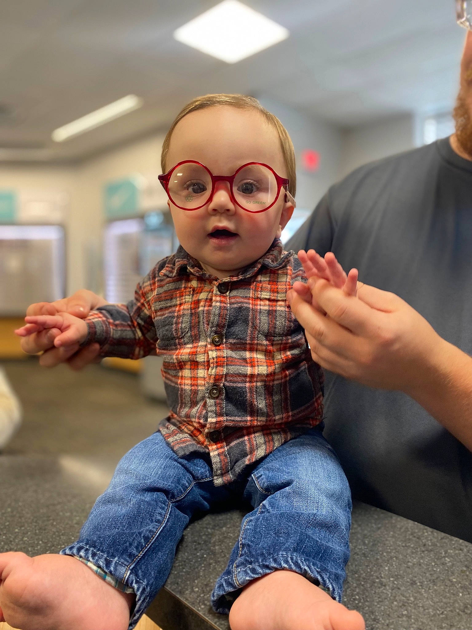 Jasper joined the competition — help win amazing prizes! beard, cool, denim, eyewear, finger, flooring, gesture, glasses, happy, jeans, person, personal_protective_equipment, plaid, shoulder, sitting, sleeve, t_shirt, tartan, toddler, toy