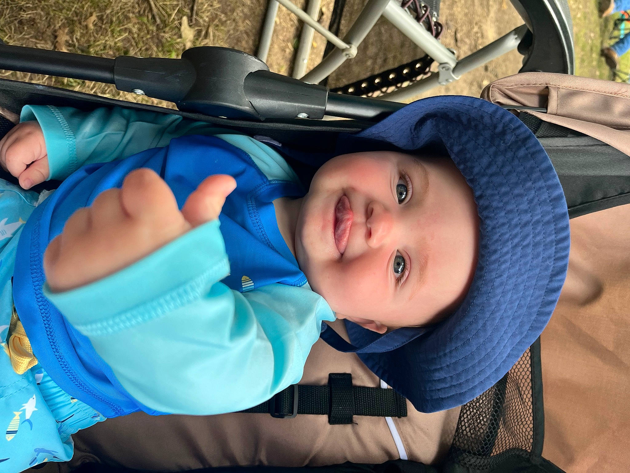 Jasper is registered to the contest to win money with this photo: baby, baby_carriage, baby_products, baby_toddler_clothing, blue, child, comfort, electric_blue, eye, face, fun, happy, hat, headwear, joy, leisure, person, recreation, smile, toddler