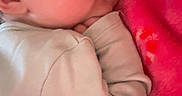 Maeve is registered to the contest to win money with this photo: baby, sleeping, blanket, pink, infant, closeup, face, peaceful, cozy, soft, child, resting, cute, hand, clothing, portrait, indoors, relaxing, newborn, warm