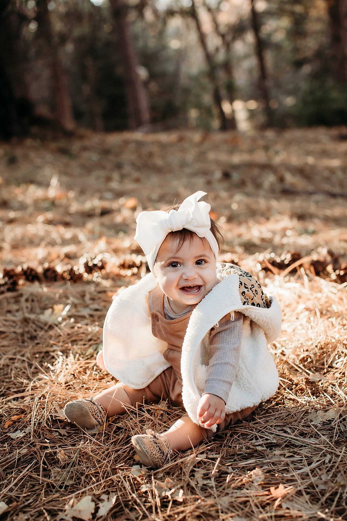 Avani is registered to the contest to win money with this photo: baby, child, deciduous, flash_photography, forest, grass, happy, hat, headwear, landscape, natural_landscape, people_in_nature, person, plant, smile, sunlight, toddler, tree, wilderness, wood