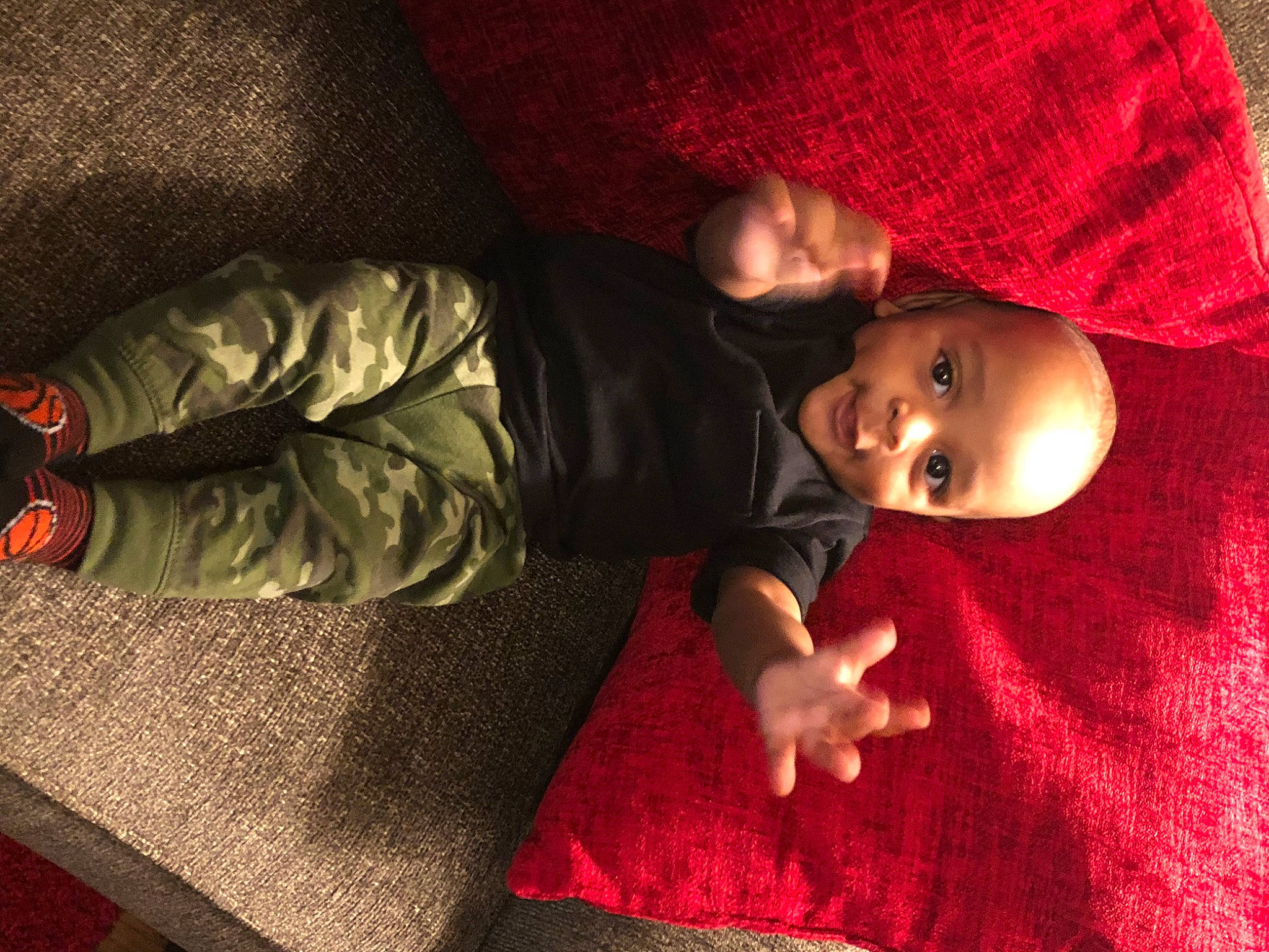 Garrick is registered to the contest to win money with this photo: baby, child, fun, person, red, smile, toddler