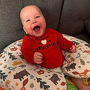 Lukas joined the competition — help win amazing prizes! baby, child, smiling, red_shirt, cushion, animal_print, owl, fox, bear, bird, tree, mushroom, couch, happy, indoor, portrait, infant, cute, laughing, comfort