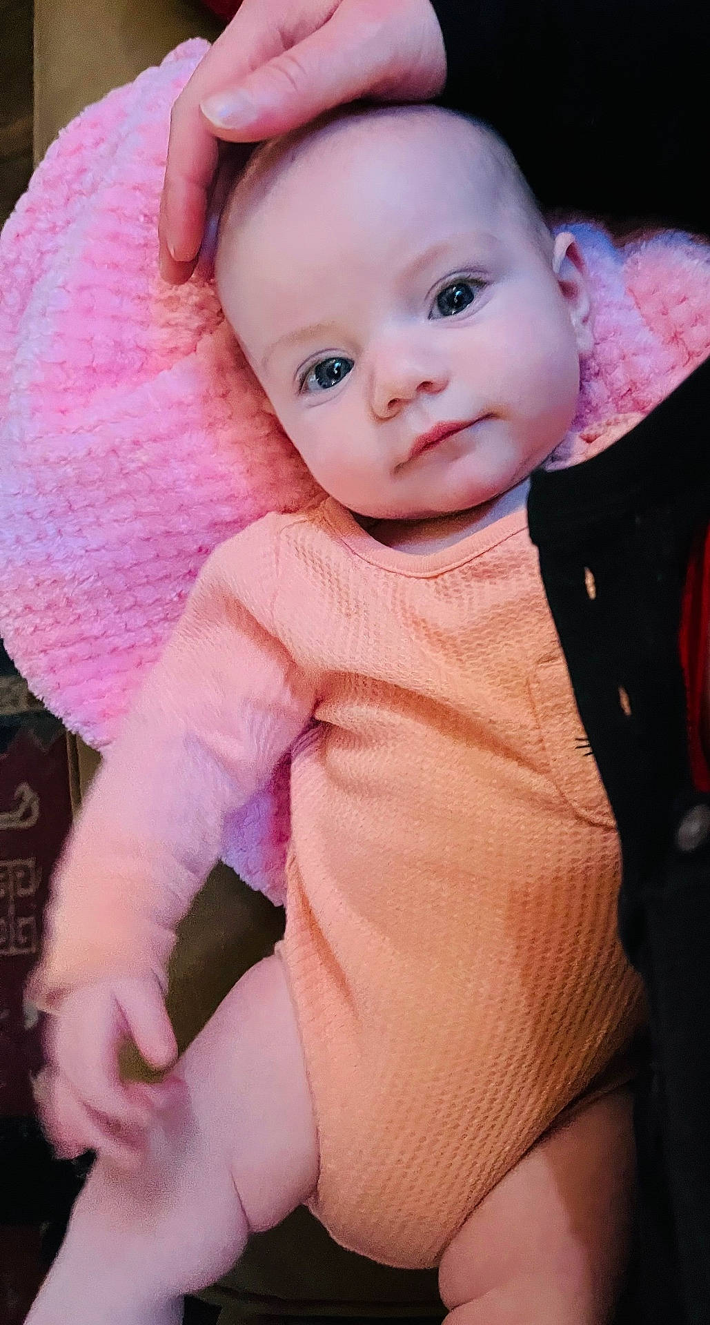 baby, bodypart, bonnet, cap, clothing, coat, face, finger, hand, happy, hat, head, jacket, knitwear, newborn, person, photography, portrait, smile, sweater