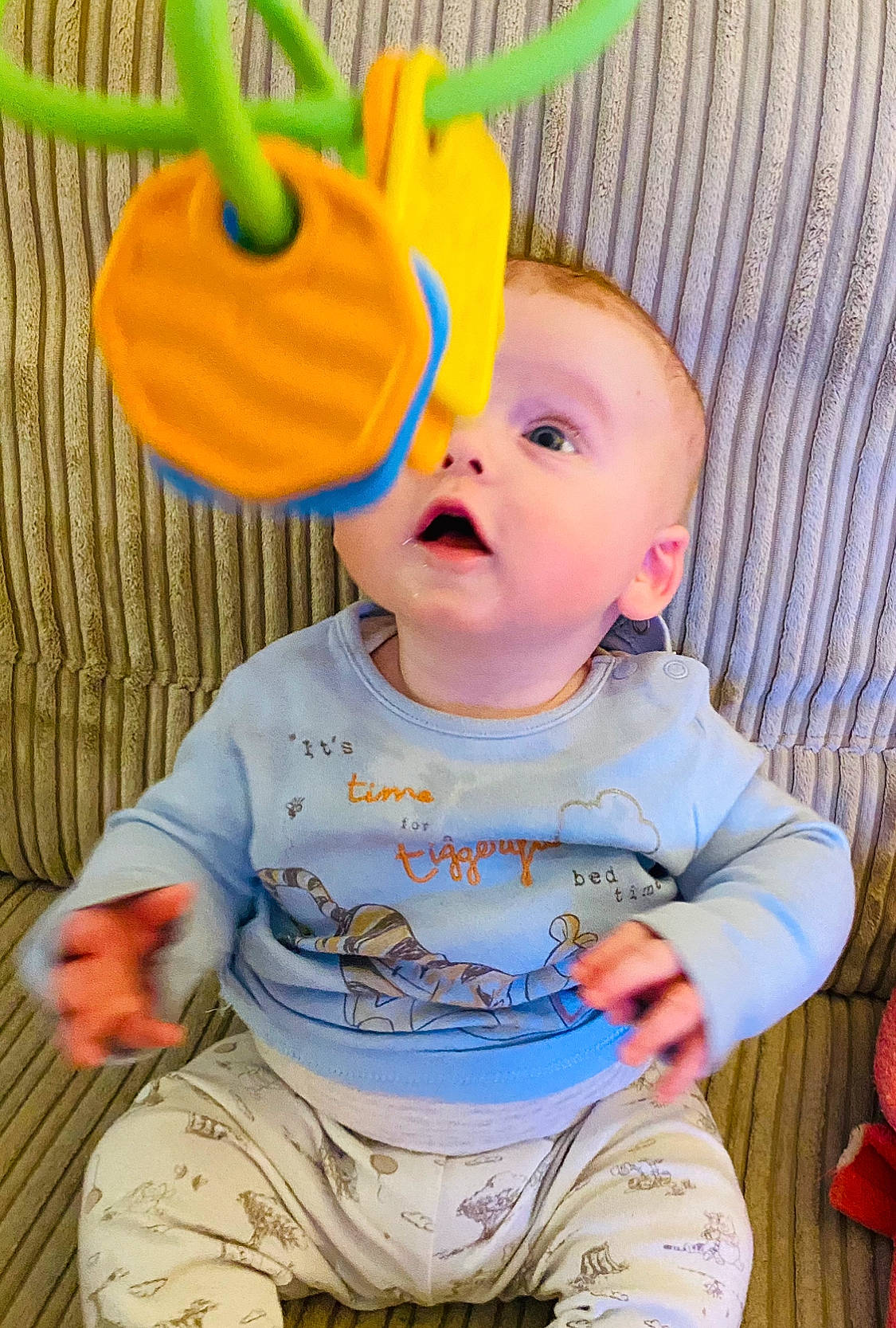 Logan joined the competition — help win amazing prizes! baby, baby_toddler_clothing, cap, cheek, child, face, fun, green, happy, nose, orange, person, pink, product, skin, sleeve, t_shirt, textile, toddler, white