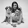 Aïko participe au concours pour gagner de l'argent avec cette photo : black_and_white, couple, dog, portrait, studio, smiling, laying_down, casual_clothing, young_adults, pet, indoor, striped_shirt, watch, fluffy_dog, friendly, togetherness, happy, looking_at_camera, people, animal