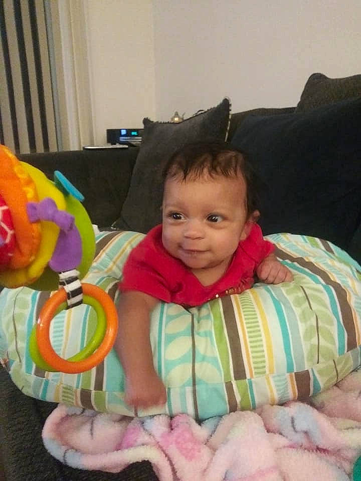 Ja Nylah joined the competition — help win amazing prizes! baby, cheek, child, face, linens, person, pink, play, room, sitting, skin, smile, textile, toddler, toy, tummy_time