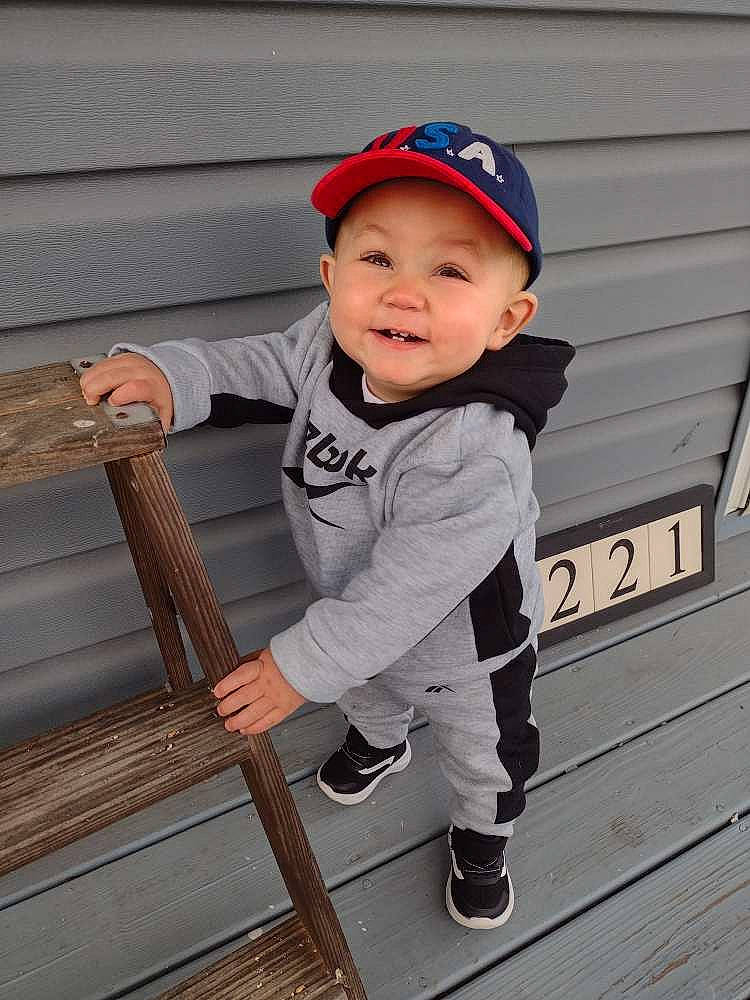 Brixton joined the competition — help win amazing prizes! baby, baby_toddler_clothing, baseball_cap, cap, carmine, child, composite_material, cricket_cap, electric_blue, happy, hat, headwear, leg, outerwear, person, sitting, sleeve, smile, standing, street_fashion
