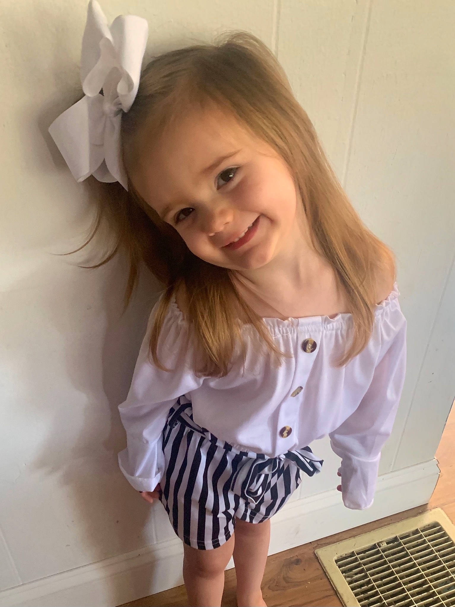 Kamdyn is registered to the contest to win money with this photo: baby_toddler_clothing, beauty, child, clothing, dress, hair, happy, human_body, joy, knee, neck, pattern, person, pink, shorts, skin, sleeve, smile, t_shirt, thigh