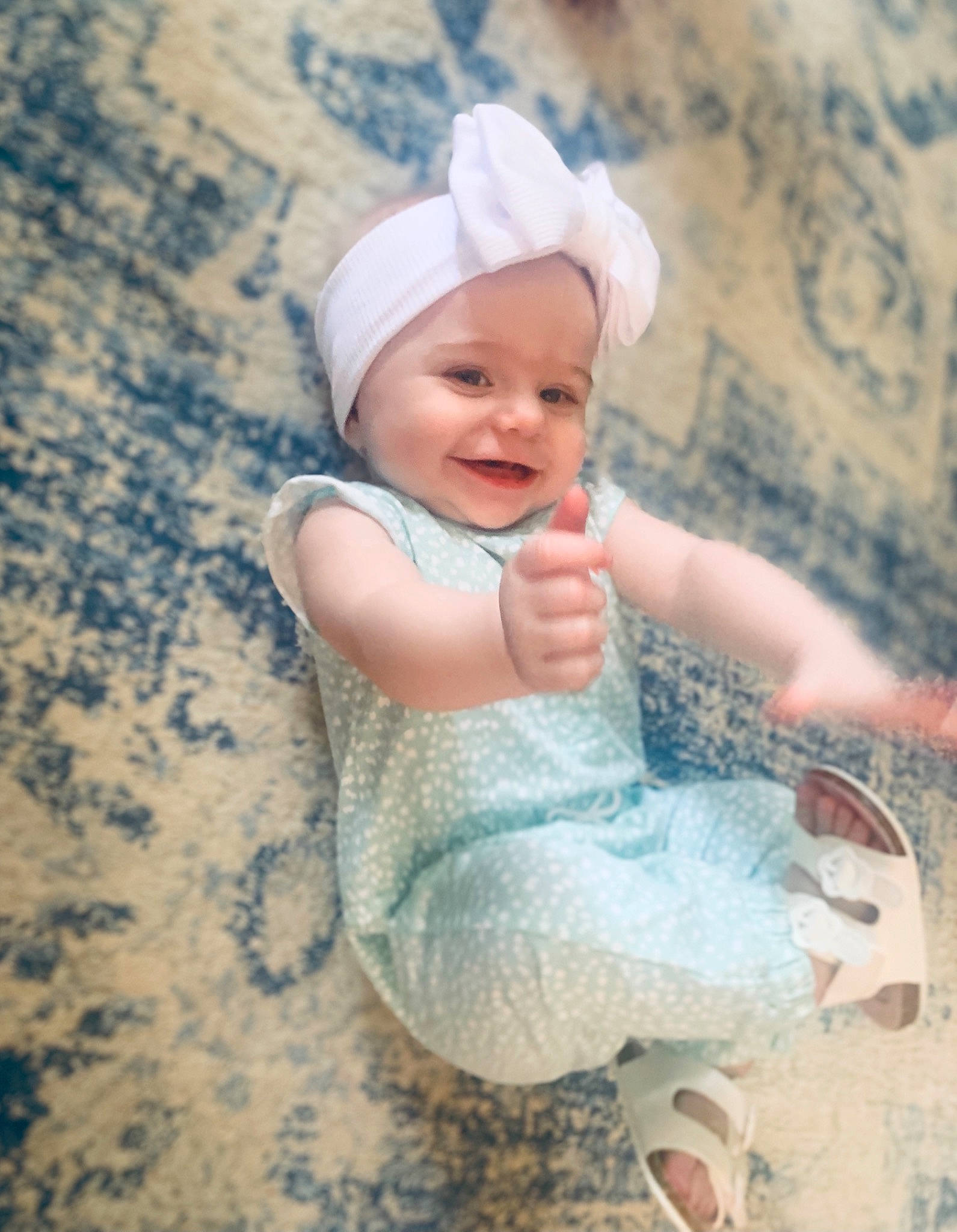 Jolene is registered to the contest to win money with this photo: baby, baby_toddler_clothing, beach, body_of_water, cap, child, fashion_accessory, flash_photography, fun, grass, happy, hat, headwear, landscape, people_in_nature, person, play, sand, sitting, skin