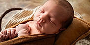 Maylon participe au concours pour gagner de l'argent avec cette photo : newborn, baby, sleeping, blanket, pillow, infant, wrapped, cozy, peaceful, soft, closeup, resting, skin, face, hand, indoors, warm, cute, portrait, child
