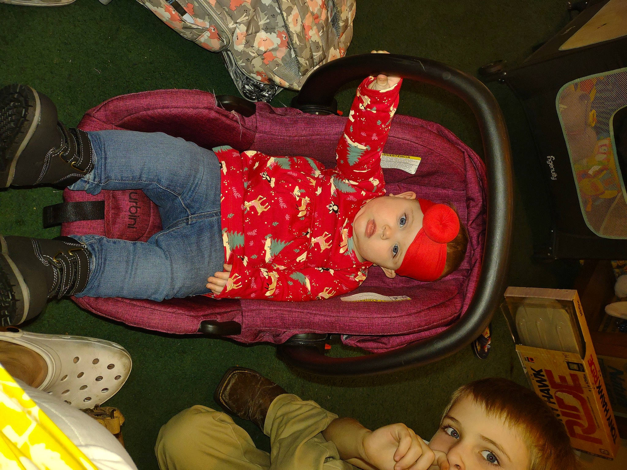 Carlee joined the competition — help win amazing prizes! baby, baby_products, baby_safety, baby_toddler_clothing, carmine, child, comfort, fun, hat, headwear, human_leg, lap, organ, pattern, person, product, red, room, sitting, thigh