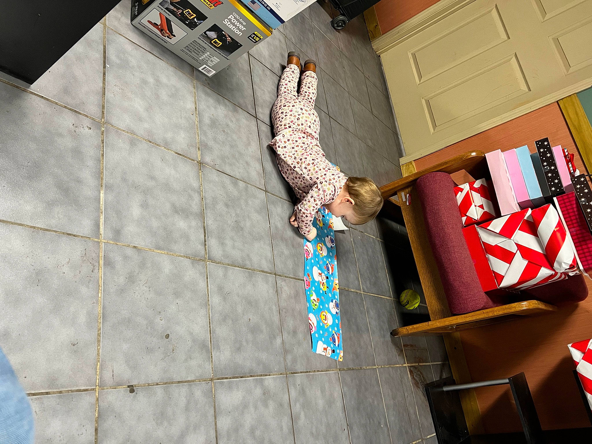 Carlee is registered to the contest to win money with this photo: advertising, art, cabinetry, chest_of_drawers, composite_material, concrete, facade, flooring, font, leisure, pattern, person, recreation, rectangle, room, shadow, space, visual_arts, wood, world