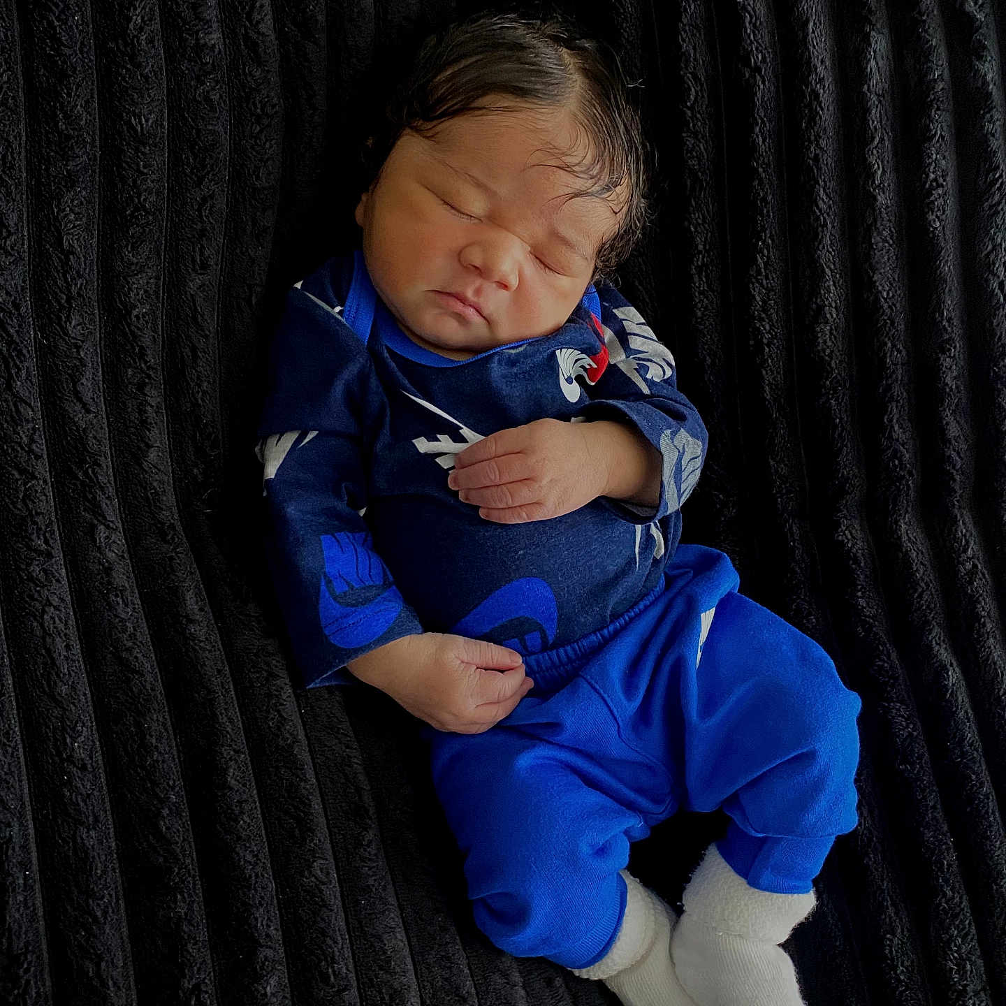 Haven Mccaster joined the competition — help win amazing prizes! baby, black_blanket, blue_clothing, calm, child, closeup, cozy, cute, human, indoors, infant, newborn, peaceful, portrait, resting, sleeping, small_feet, small_hands, soft_texture, white_socks