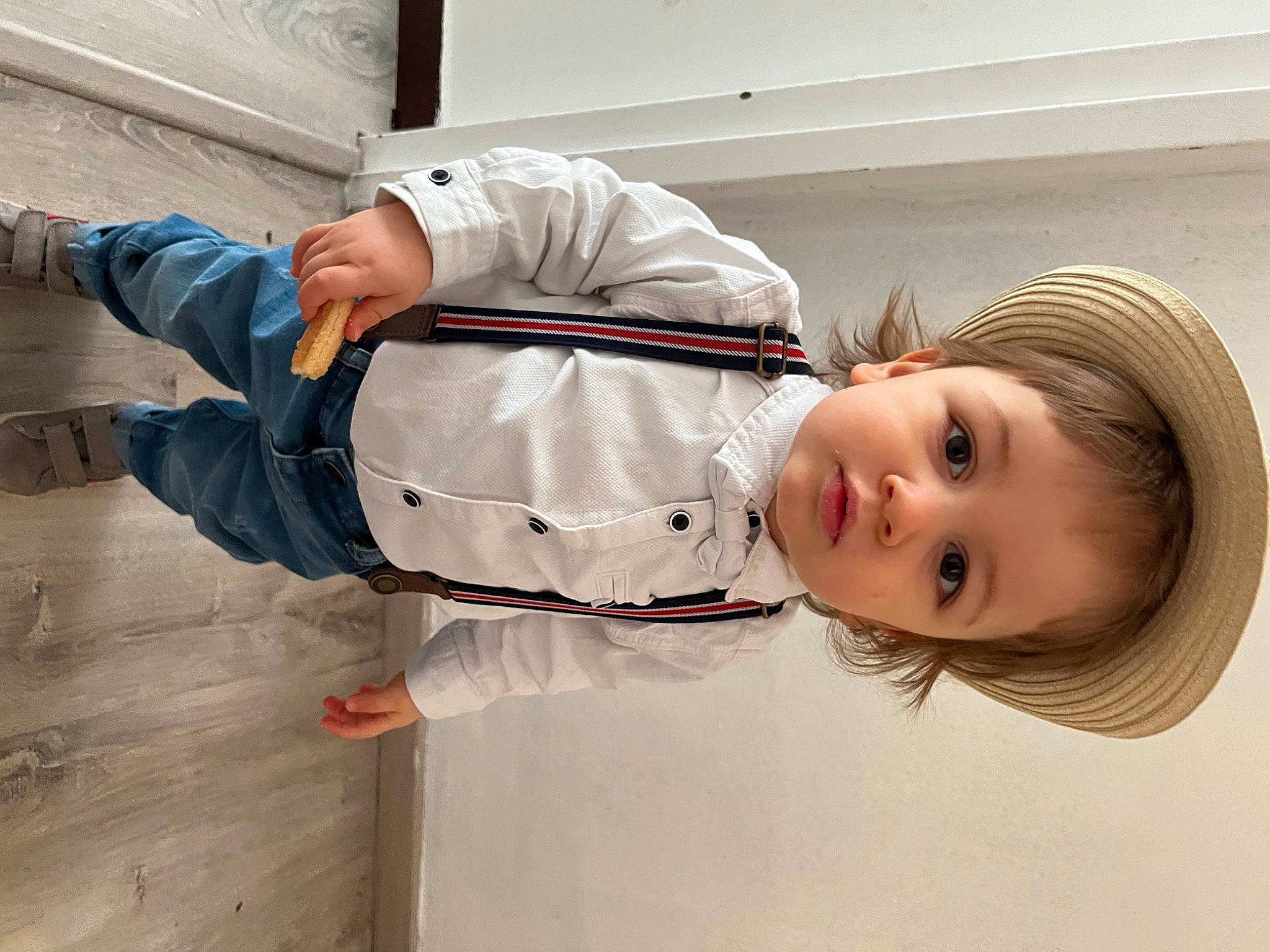 Logan participe au concours pour gagner de l'argent avec cette photo : baby_toddler_clothing, child, collar, comfort, flooring, happy, hardwood, hat, khaki_pants, outerwear, person, portrait_photography, room, sitting, sleeve, toddler, wood