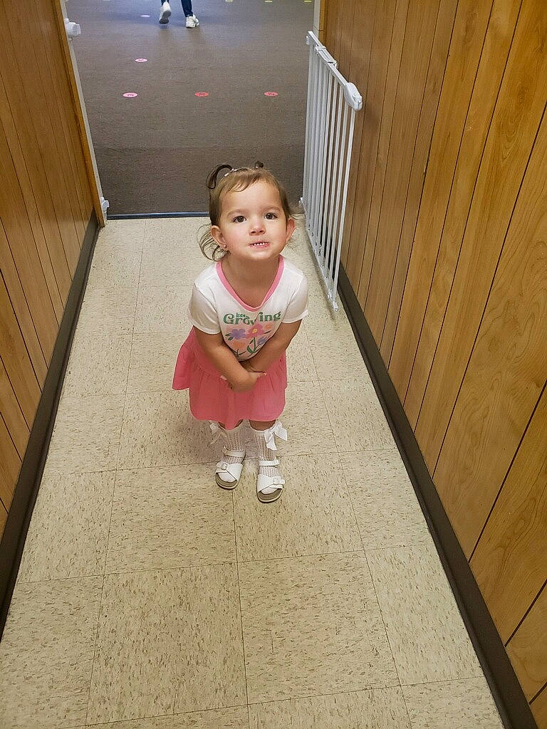 Adelynn is registered to the contest to win money with this photo: baby, baby_toddler_clothing, child, floor, flooring, foot, hardwood, human_leg, leg, pattern, person, sandal, sitting, sleeve, stairs, thigh, toddler, varnish, wood, wood_flooring