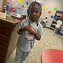 Serenity is registered to the contest to win money with this photo: accessories, bracelet, child, clothing, face, female, footwear, girl, hair, happy, head, jeans, jewelry, pants, person, shoe, sitting, sleeve, smile, standing