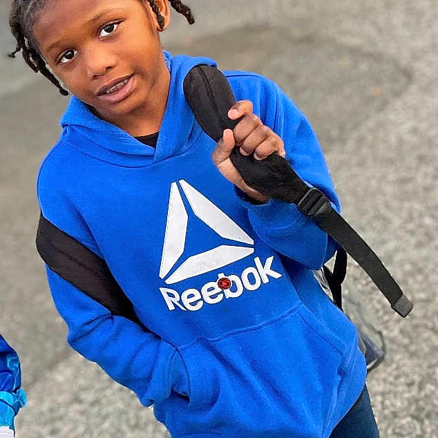 Jase joined the competition — help win amazing prizes! boy, child, city, clothing, coat, face, footwear, grass, head, jacket, jeans, male, nature, outdoors, pants, person, photography, portrait, shoe, walking