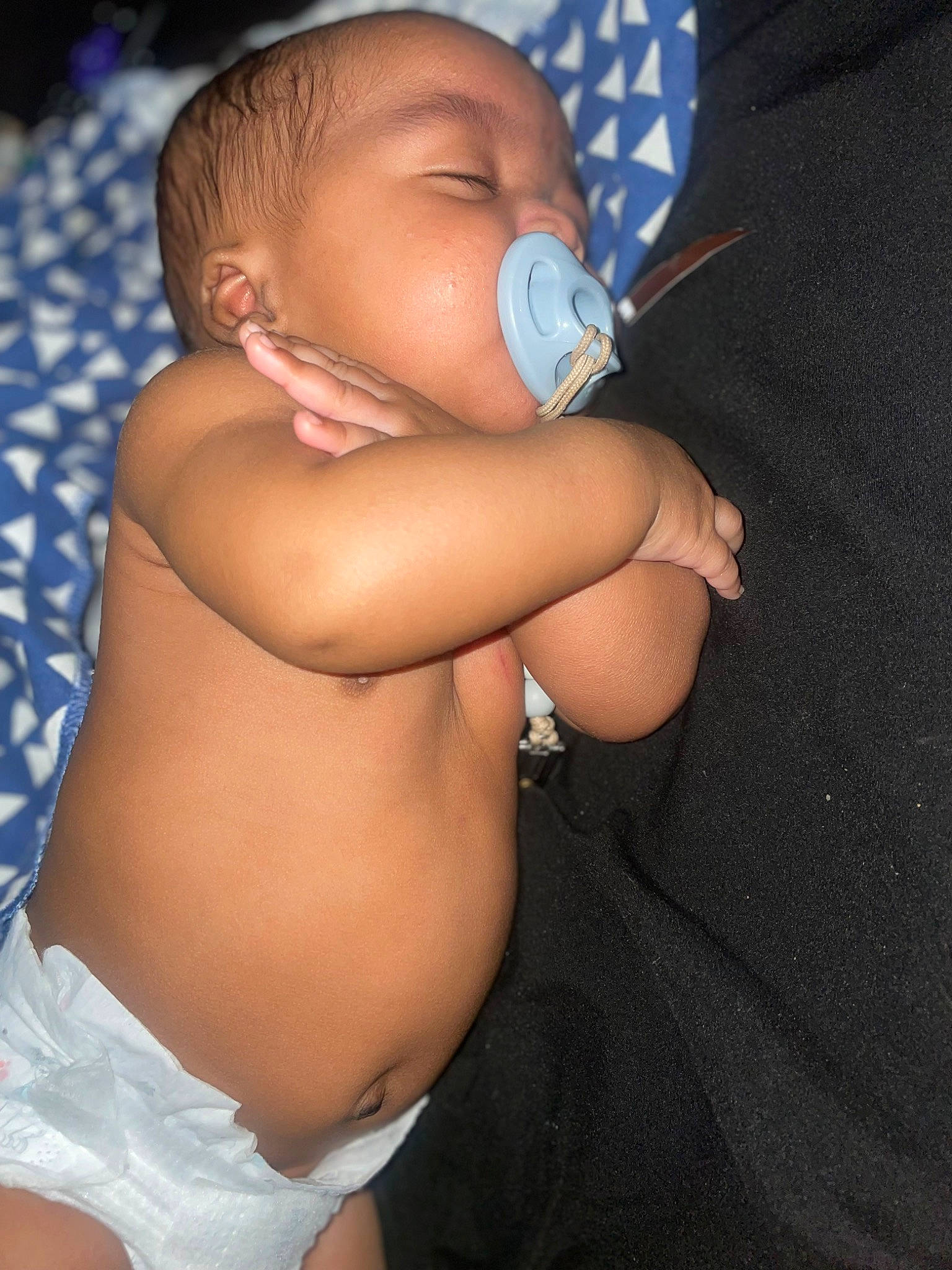 Ah Zy is registered to the contest to win money with this photo: abdomen, arm, baby, baby_toddler_clothing, blue, chest, child, comfort, elbow, finger, flash_photography, human_leg, joint, mouth, person, skin, stomach, thigh, thumb, toddler