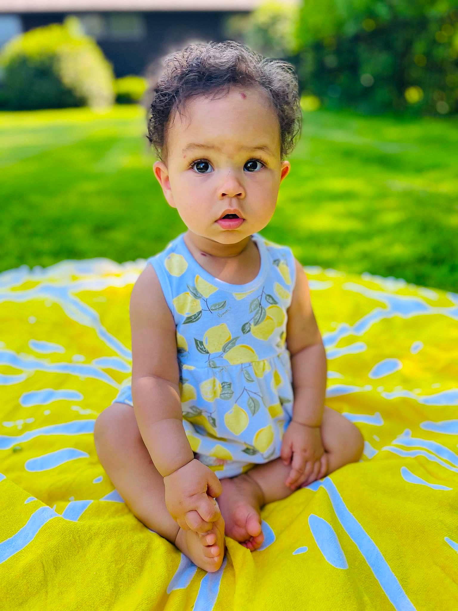 Aubrielle is registered to the contest to win money with this photo: baby, baby_toddler_clothing, beauty, child, dress, face, fun, grass, happy, leaf, leisure, pattern, people_in_nature, person, photograph, plant, skin, sleeve, surprise, t_shirt
