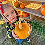 Matthew joined the competition — help win amazing prizes! autumn, casual_clothing, child, curious, cute, daylight, face, fall, grass, harvest, holding, knit_hat, nature, orange, outdoor, portrait, pumpkin, shoes, toddler, wooden_shelf