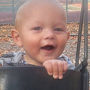 Cain joined the competition — help win amazing prizes! baby, child, smiling, swing, playground, park, autumn, leaves, close_up, face, hand, seat, chain, fence, outdoor, portrait, baby_clothes, cheerful, blurred_background, daylight