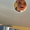 child, closeup, curious, daylight, expression, eyes, face, fun, happy, hole, innocence, mouth, outdoor, peeking, play, playground, skin, smile, toddler, white_clothing