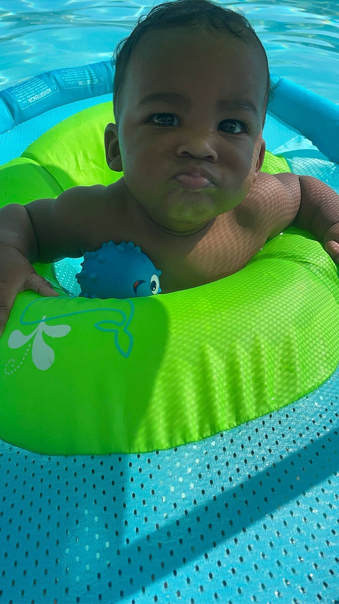 Zaylen joined the competition — help win amazing prizes! baby, clothing, face, head, leisureactivities, lifejacket, nature, outdoors, person, photography, pool, portrait, sport, summer, swimming, swimmingpool, swimwear, vest, water, watersports