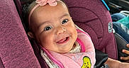 Nayeli joined the competition — help win amazing prizes! baby, car_seat, smile, pink_bib, headband, avocado_design, car_interior, child, seatbelt, happy, person, clothing, safety_harness, infant, cute, portrait, seat, baby_accessory, car_window, family