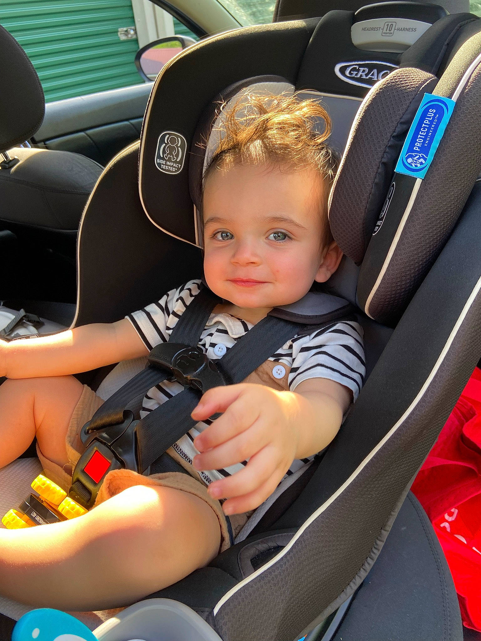Camdyn joined the competition — help win amazing prizes! auto_part, automotive_design, automotive_exterior, automotive_tire, car, car_seat, car_seat_cover, comfort, motor_vehicle, person, personal_luxury_car, plant, smile, sneakers, steering_part, steering_wheel, thigh, toddler, vehicle, vehicle_door