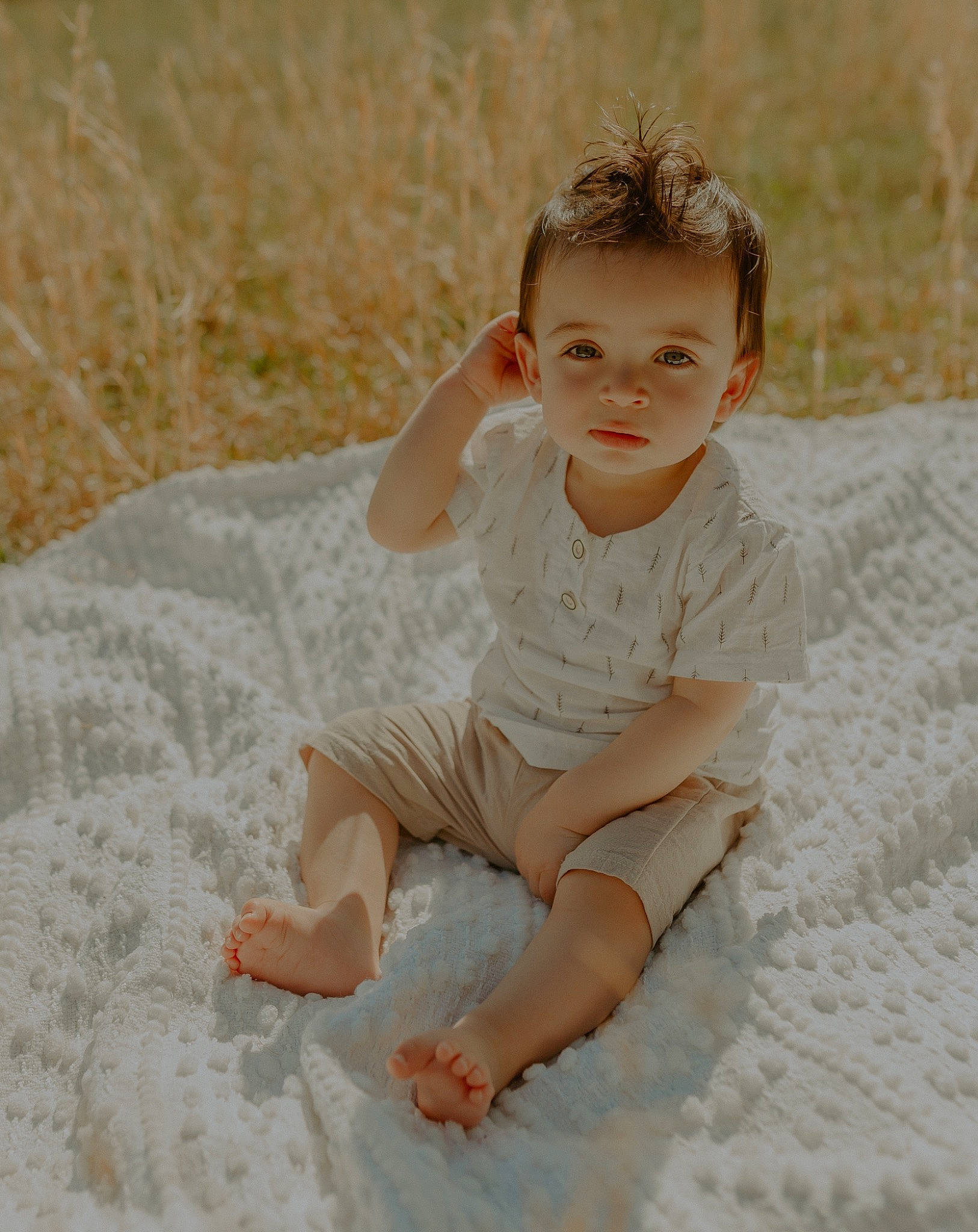Camdyn is registered to the contest to win money with this photo: baby, baby_toddler_clothing, child, comfort, dress, flash_photography, flooring, grass, happy, human_body, human_leg, leg, neck, pattern, person, sand, skin, sleeve, thigh, toddler