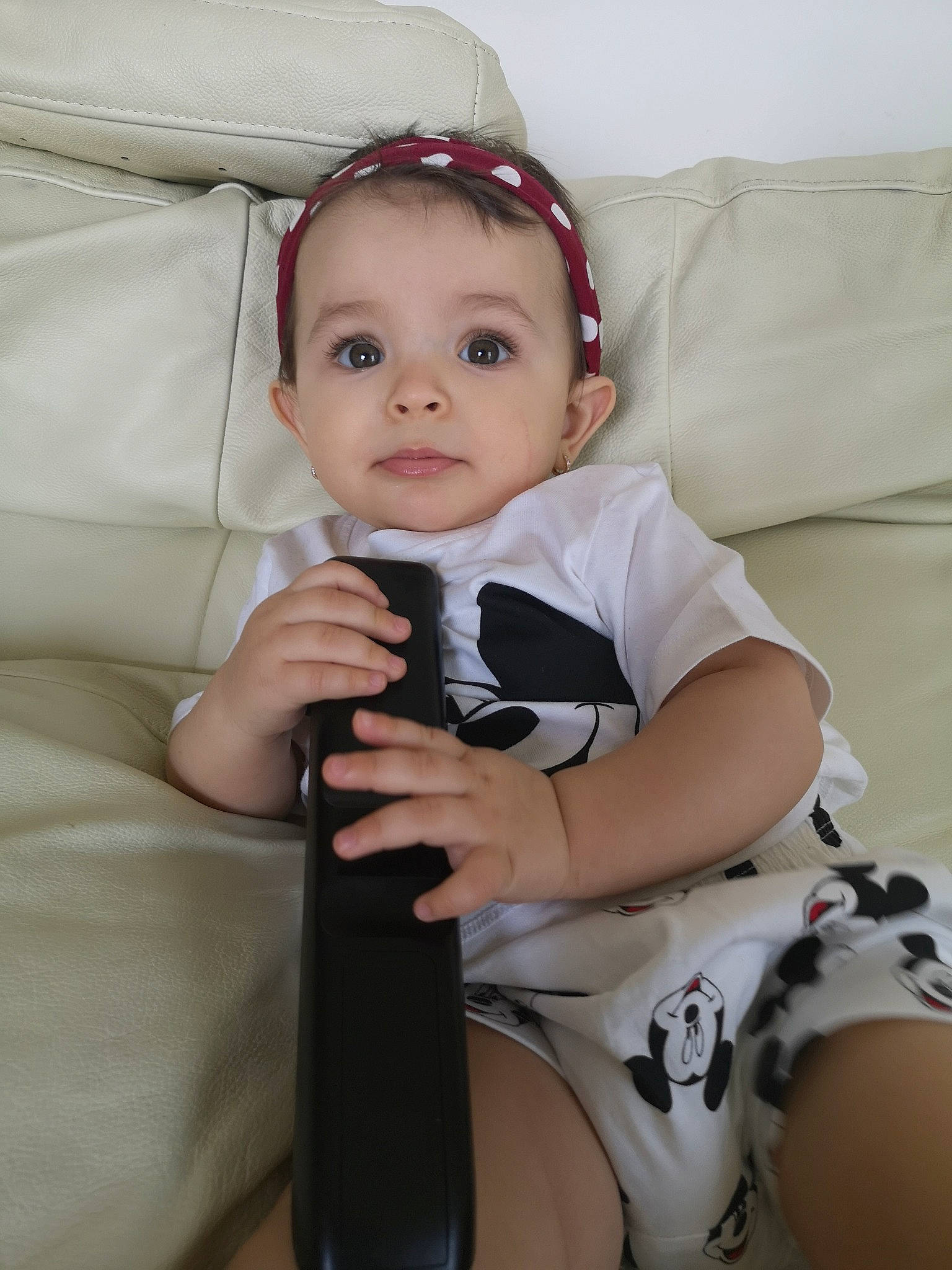 Emilie is registered to the contest to win money with this photo: arm, baby, baby_products, baby_toddler_clothing, cheek, child, eye, head, headgear, leg, person, product, skin, toddler