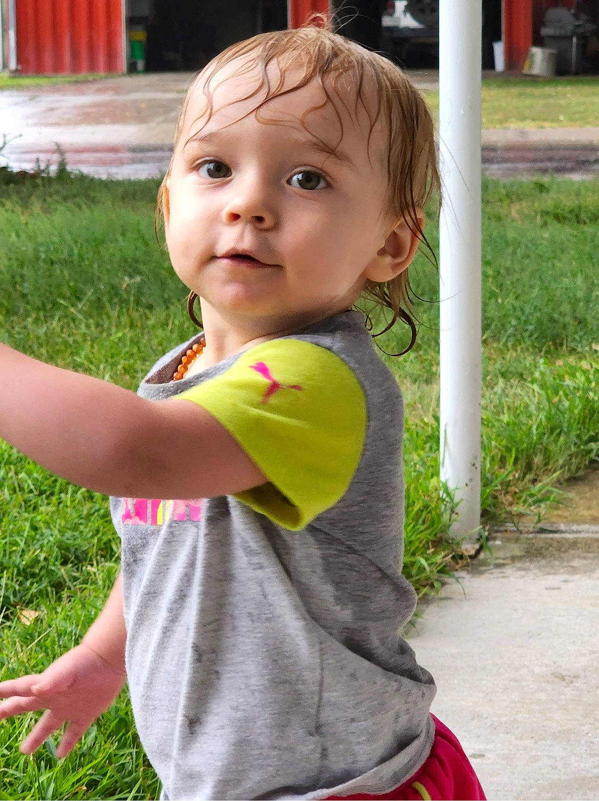 Ansley is registered to the contest to win money with this photo: baby, baby_toddler_clothing, botany, child, fun, garden, gesture, grass, hairstyle, happy, leisure, people_in_nature, person, pink, plant, play, sitting, sleeve, spring, t_shirt