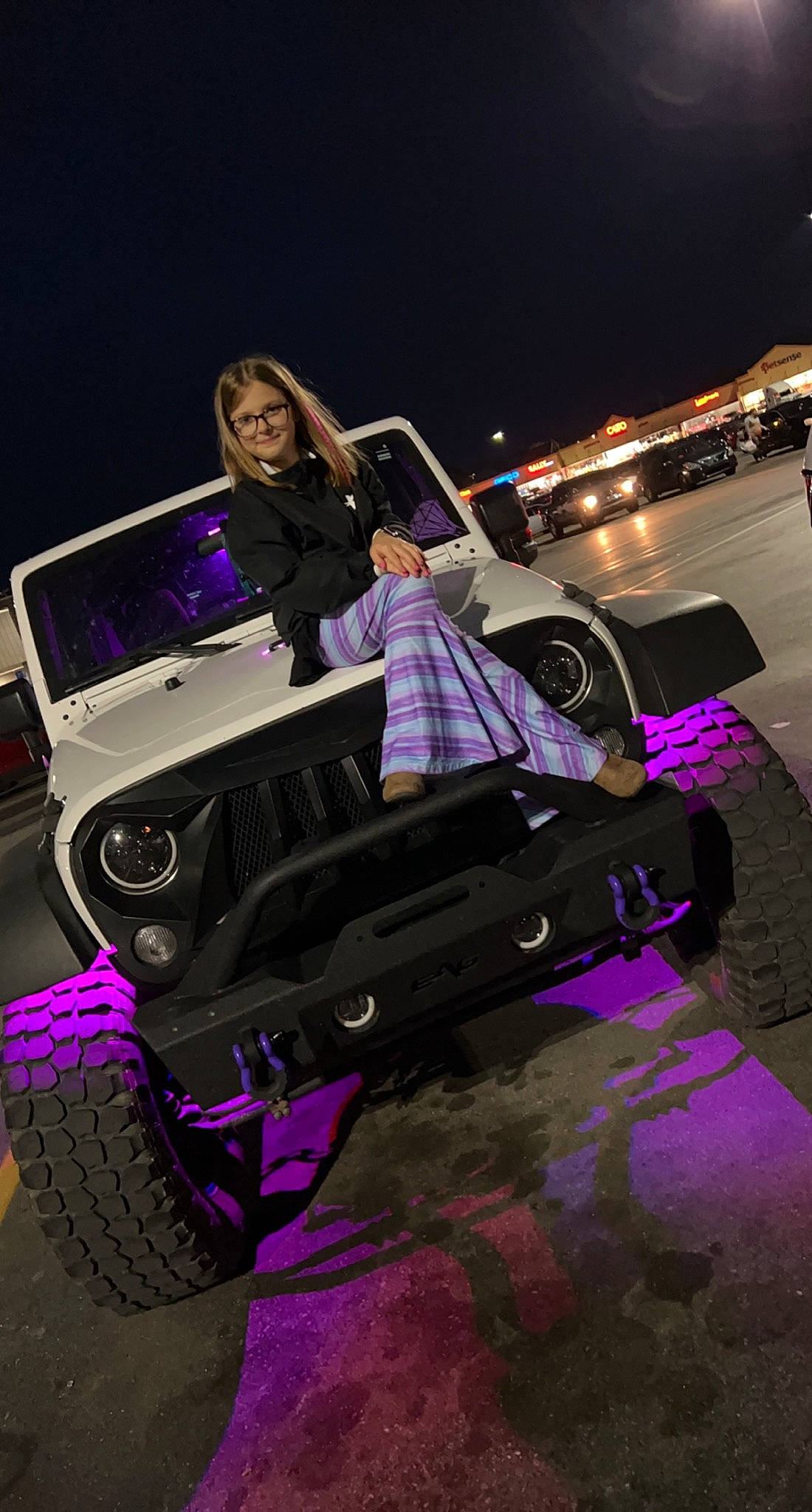 Brinleigh is registered to the contest to win money with this photo: automotive_design, automotive_exterior, automotive_lighting, automotive_tire, automotive_wheel_system, bumper, car, entertainment, fun, hood, joy, motor_vehicle, music, music_artist, musician, performing_arts, person, pink, purple, tire