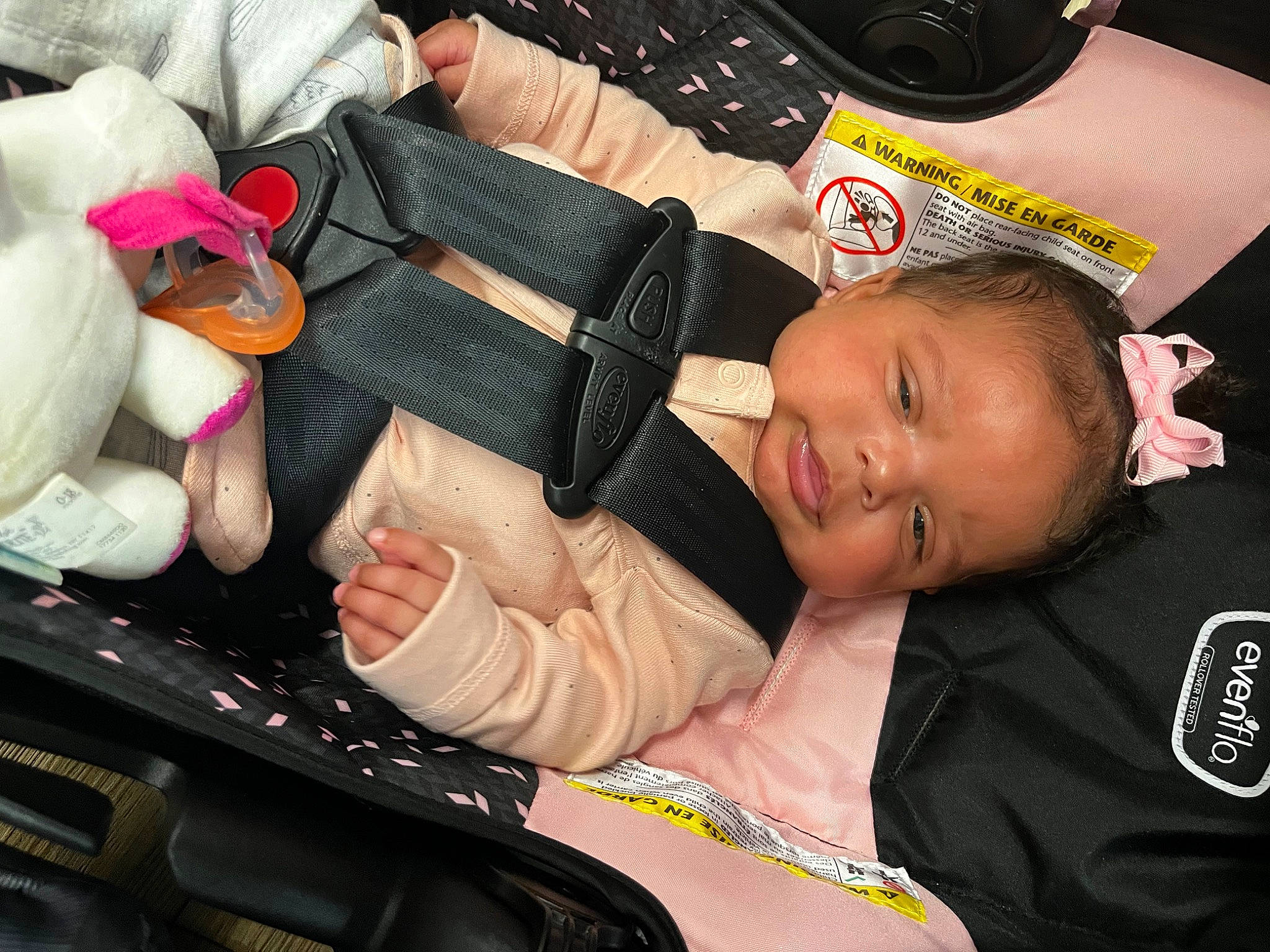 Genevieve is registered to the contest to win money with this photo: arm, auto_part, baby, baby_carriage, baby_products, baby_toddler_clothing, car_seat, carmine, child, comfort, finger, hand, lap, nail, person, sitting, smile, thigh, thumb, toddler